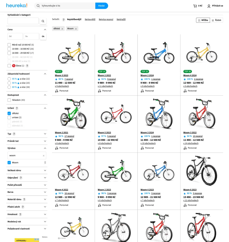 Stránka Heureky zobrazuje nabídku dětských kol značky Woom. V nabídce jsou různé modely kol Woom v různých barvách (červená, žlutá, modrá, zelená) a velikostech. U každého kola jsou uvedeny ceny, recenze a hodnocení. Některé modely mají označení "TOP", což naznačuje, že jde o oblíbené produkty. Kola jsou rozdělená podle modelového roku, jako například Woom 3 2023, Woom 4 2022 a další. Cena kol se pohybuje od přibližně 9 000 Kč do 23 000 Kč.