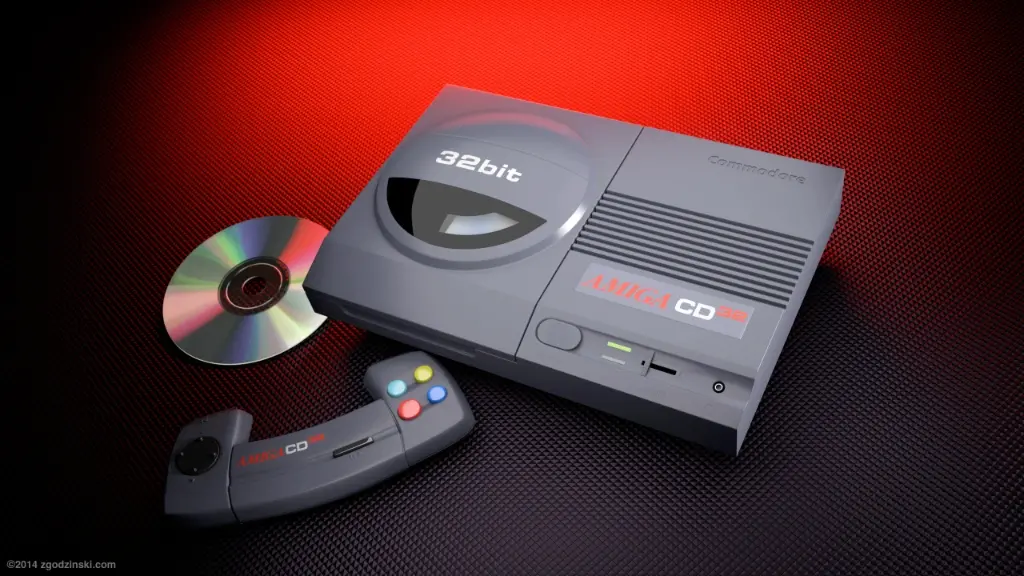 Herní konzole Amiga CD32 s přiloženým CD a gamepadem. Byla to první 32bitová herní konzole, která používala CD disky, a byla oblíbená mezi hráči pro svou pokročilou grafiku a zvuk.