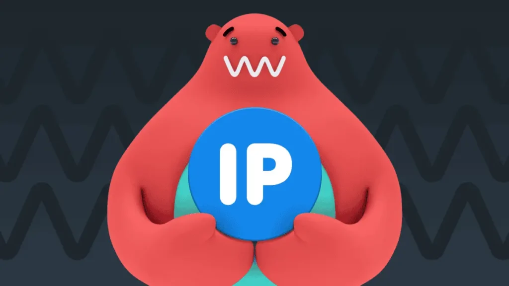 Ilustrace červeného medvěda s roztomilým kresleným výrazem držícího modrou kouli s nápisem „IP“. Pozadí je tmavé se vzorem vlnovek, což evokuje technologické téma.